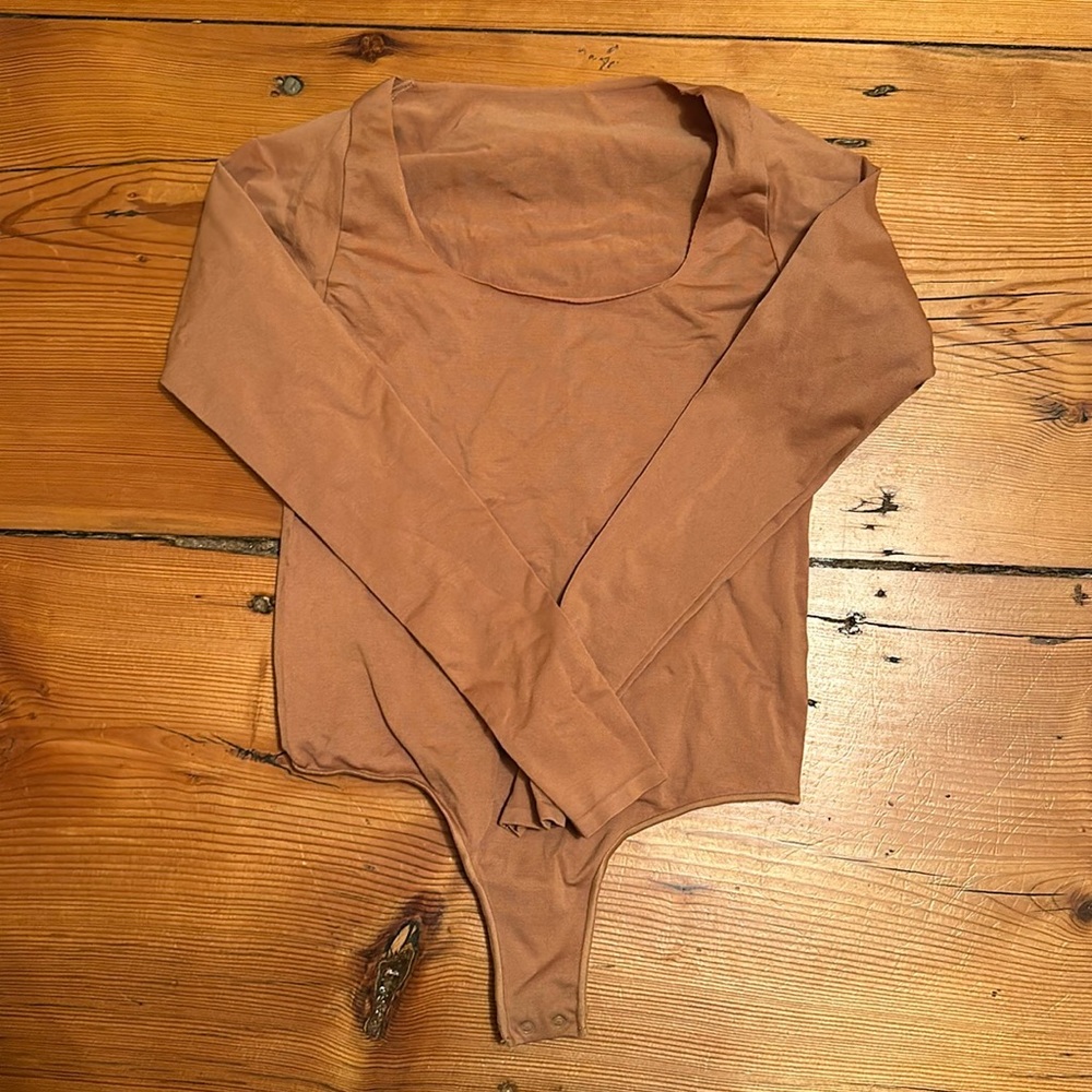 Skims bodysuit in a brown color